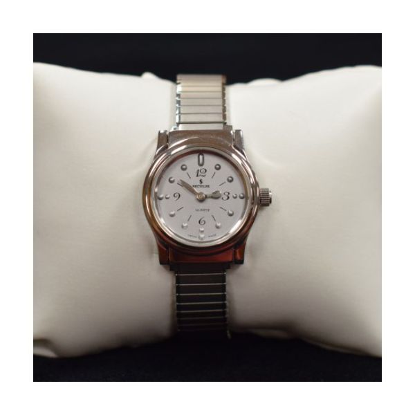 A tactile watch features a silver-tone, 3/4-inch face with a chrome case, and stainless steel expansion band.