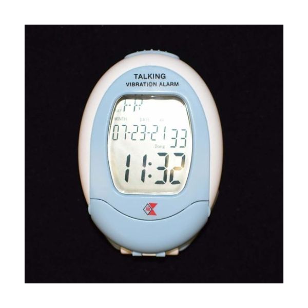 Oval-shaped blue and white talking vibration alarm with liquid quartz display.